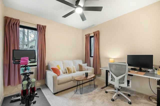 office with carpet floors and a ceiling fan