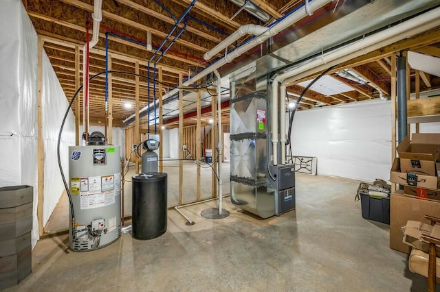 unfinished below grade area featuring heating unit and gas water heater