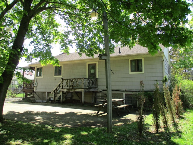 121 Wilkinson St, Chelsea, MI 48118 - rear view of property featuring stairway, a wooden deck, and roof with shingles