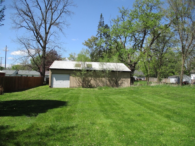 121 Wilkinson St, Chelsea, MI 48118 - view of yard with an outdoor structure and a detached garage