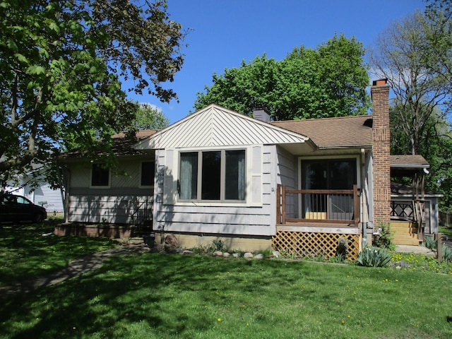 121 Wilkinson St, Chelsea, MI 48118 - view of front of home with a chimney and a front yard