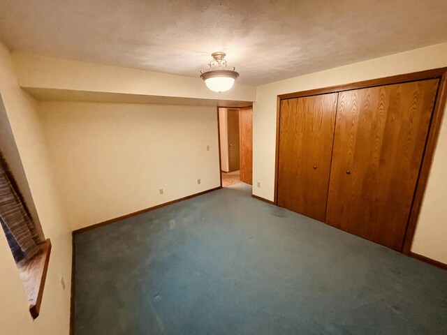 unfurnished bedroom with baseboards and carpet flooring