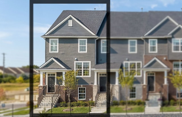townhome / multi-family property with a fenced front yard