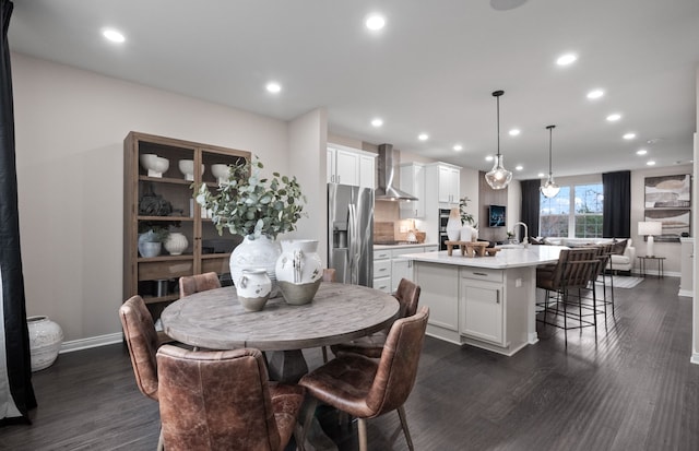 dining area featuring recessed lighting, dark wood-type flooring, and baseboards