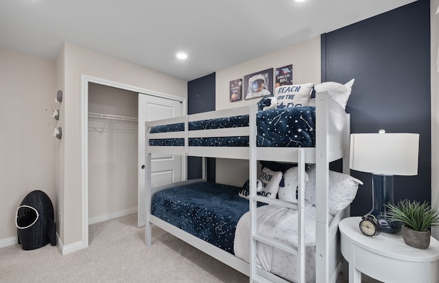 carpeted bedroom with recessed lighting, a closet, and baseboards