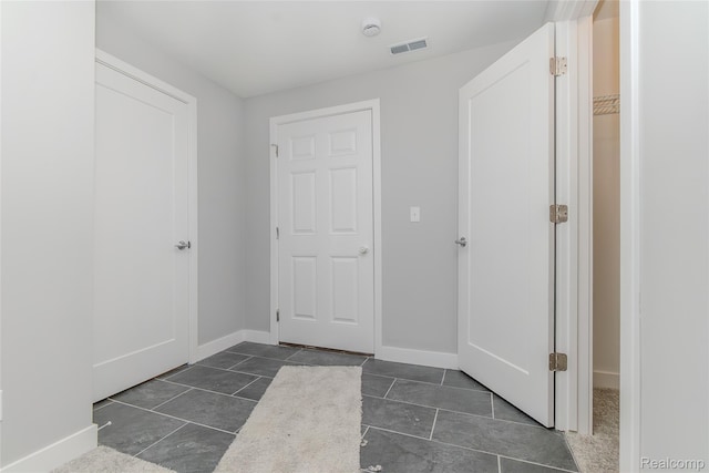 25549 Grandview Ln Unit 31, Novi, MI 48375 - entryway with baseboards and dark tile patterned floors