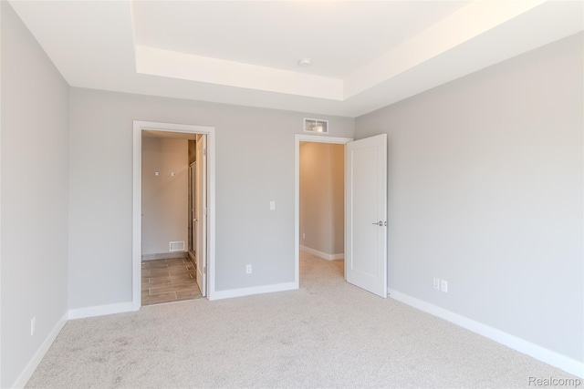 25549 Grandview Ln Unit 31, Novi, MI 48375 - unfurnished bedroom with light colored carpet and a raised ceiling
