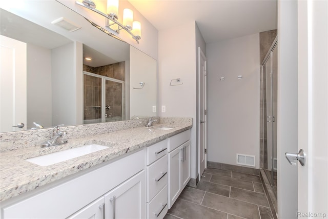 25549 Grandview Ln Unit 31, Novi, MI 48375 - bathroom with double vanity, a shower stall, and tile patterned flooring