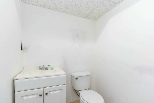 half bath with vanity and toilet