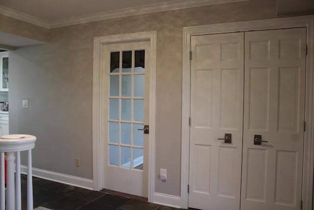 doorway to outside with baseboards and crown molding