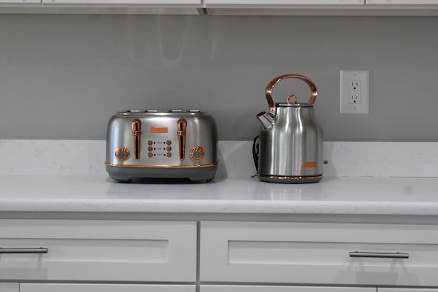 details featuring white cabinetry