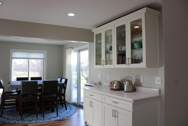 dining area with dark wood-style flooring and recessed lighting