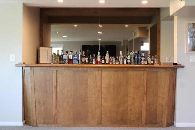 bar with a dry bar, recessed lighting, and baseboards
