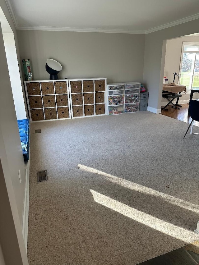 bedroom featuring carpet flooring, baseboards, and crown molding