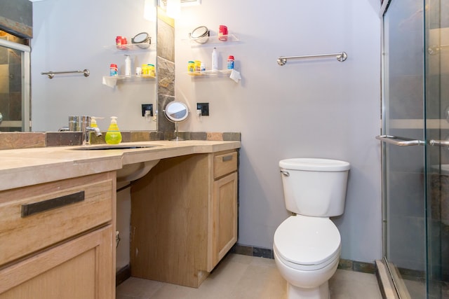 1050 Wall St Unit 3C, Ann Arbor, MI 48105 - full bath with a shower stall, toilet, vanity, and tile patterned flooring