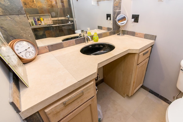 1050 Wall St Unit 3C, Ann Arbor, MI 48105 - full bath with toilet, vanity, a tile shower, and tile patterned flooring
