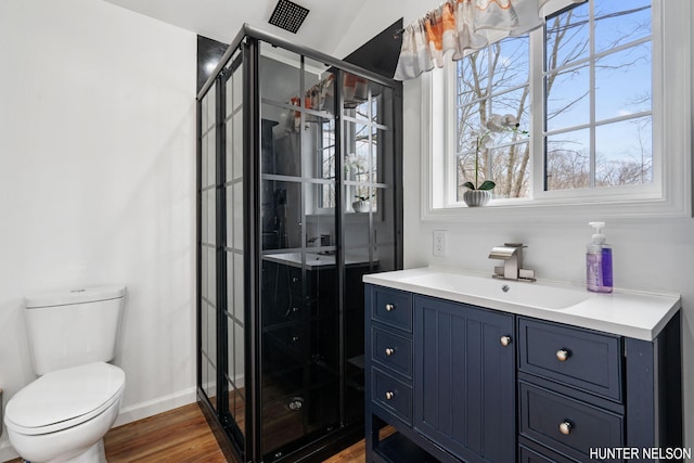 175 Cora Ave, Muskegon, MI 49445 - bathroom featuring toilet, a wealth of natural light, wood finished floors, and vanity