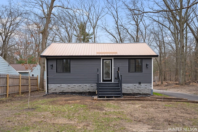175 Cora Ave, Muskegon, MI 49445 - view of front of property featuring fence and metal roof