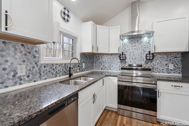 175 Cora Ave, Muskegon, MI 49445 - kitchen with a sink, white cabinets, appliances with stainless steel finishes, and wall chimney exhaust hood