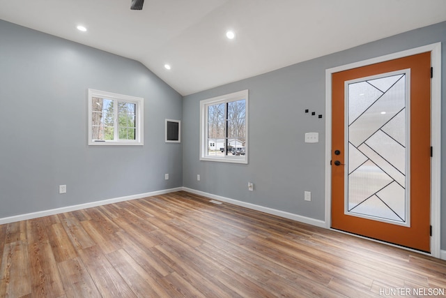 175 Cora Ave, Muskegon, MI 49445 - foyer entrance with a healthy amount of sunlight, light wood finished floors, and vaulted ceiling