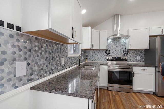 175 Cora Ave, Muskegon, MI 49445 - kitchen featuring dark stone countertops, a sink, wall chimney range hood, white cabinetry, and stainless steel appliances