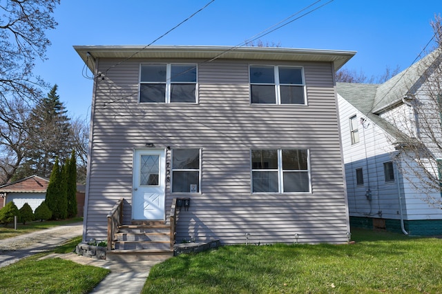 traditional home with entry steps and a front yard