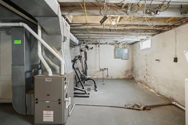basement with electric panel and heating unit