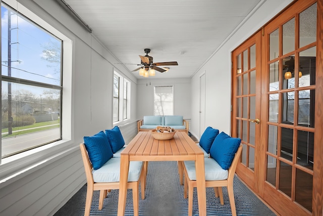 sunroom / solarium featuring ceiling fan and french doors