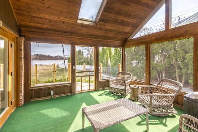 sunroom / solarium with a skylight and a water view