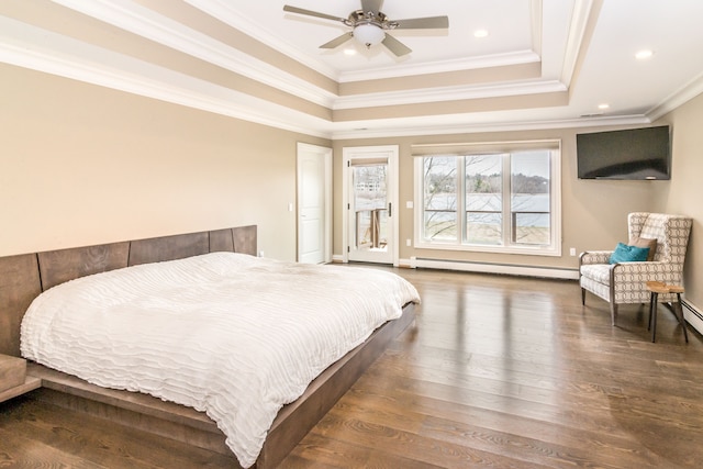 bedroom with crown molding, a baseboard radiator, a raised ceiling, recessed lighting, and wood finished floors