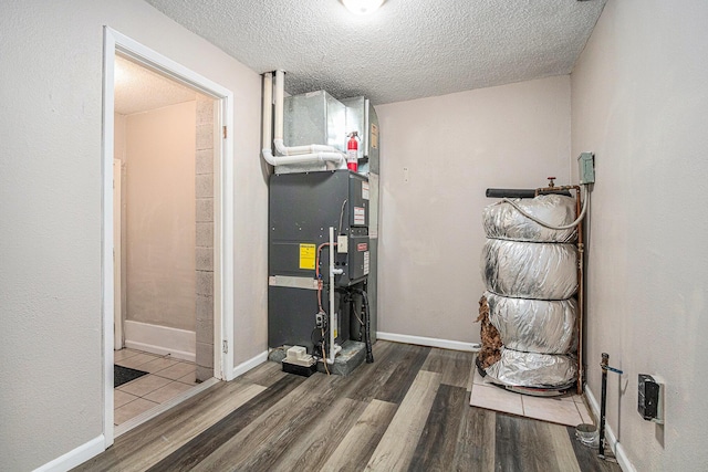 utility room with heating unit