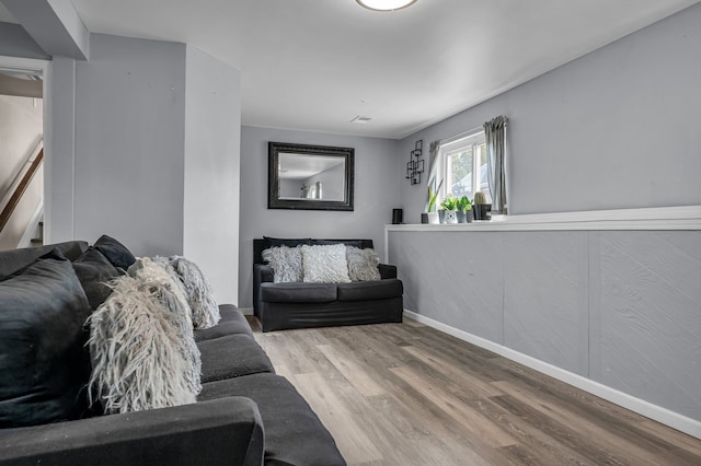 living room with wood finished floors and baseboards