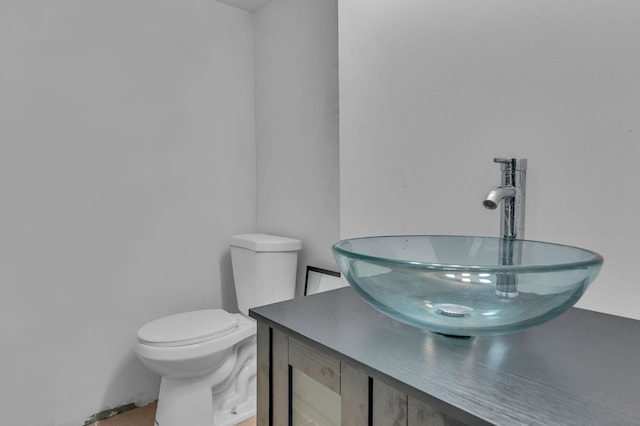 bathroom with toilet and vanity