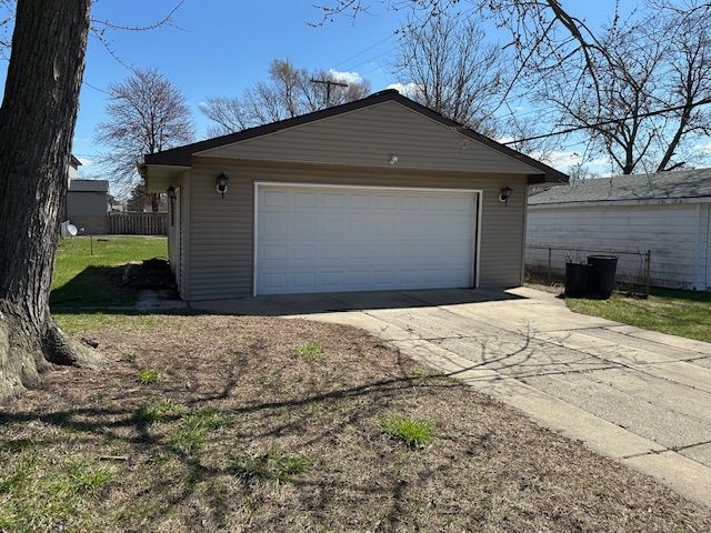detached garage with fence