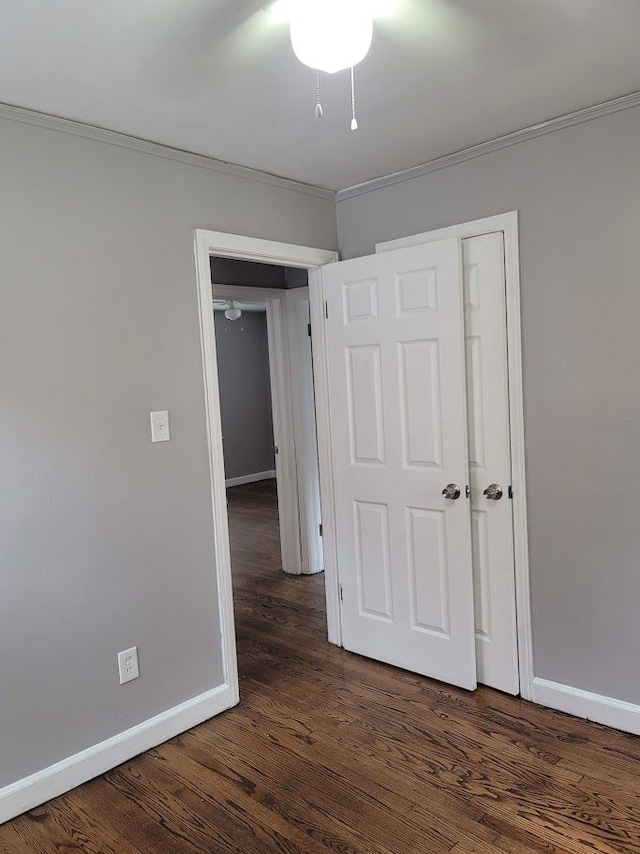 18639 Appoline St, Detroit, MI 48235 - unfurnished bedroom featuring baseboards, crown molding, and dark wood-style floors