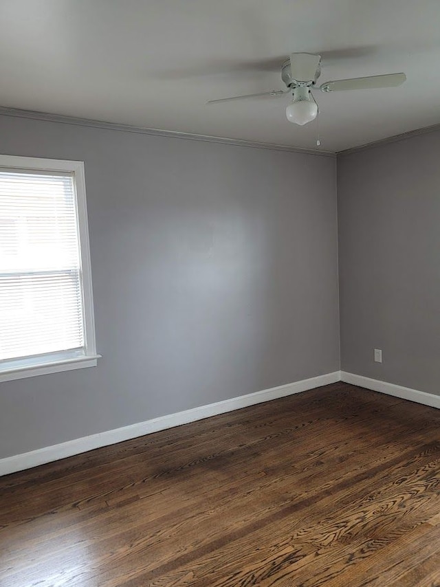 18639 Appoline St, Detroit, MI 48235 - spare room with ornamental molding, baseboards, dark wood-style floors, and a ceiling fan