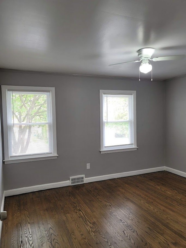 18639 Appoline St, Detroit, MI 48235 - unfurnished room featuring plenty of natural light, baseboards, and dark wood-type flooring
