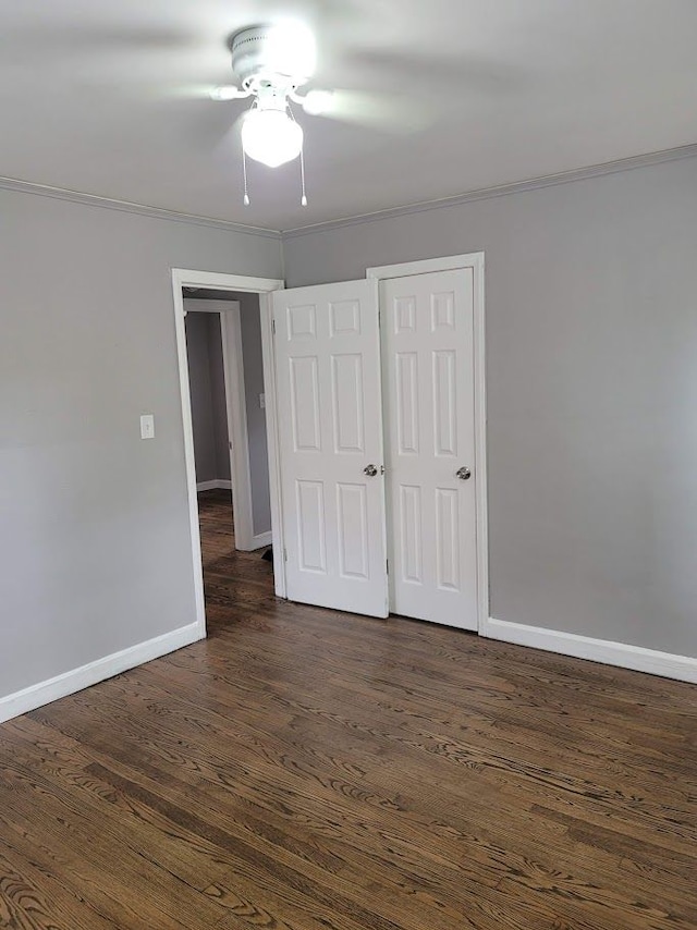 18639 Appoline St, Detroit, MI 48235 - unfurnished bedroom with ornamental molding, baseboards, dark wood-style flooring, and ceiling fan