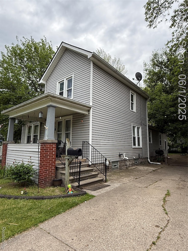 35 Grove Park St, Mount Clemens, MI 48043 - view of side of home featuring covered porch