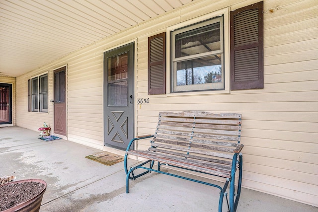 doorway to property featuring a porch