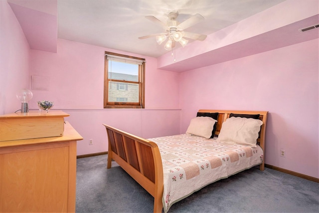 carpeted bedroom featuring ceiling fan, baseboards, and visible vents