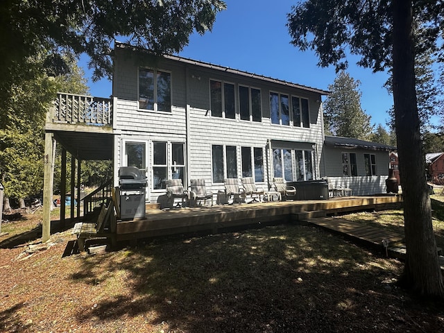 back of property with a deck