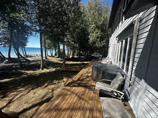 deck featuring a water view