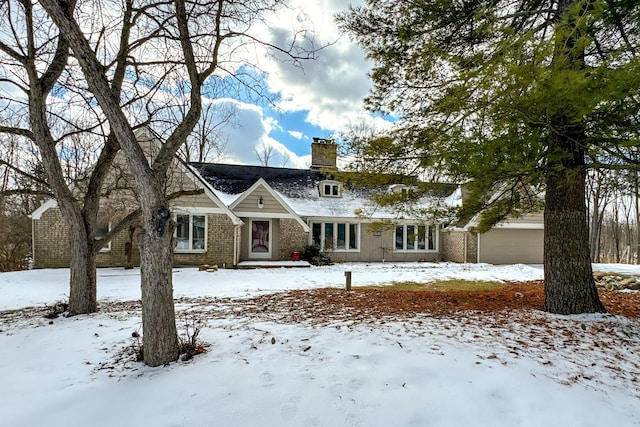 4717 Mohican Ln, Okemos, MI 48864 - view of front facade with a chimney and brick siding
