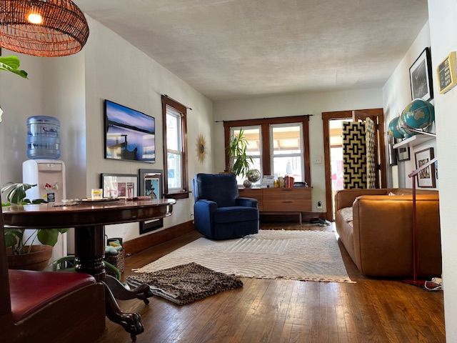 living area with hardwood / wood-style flooring
