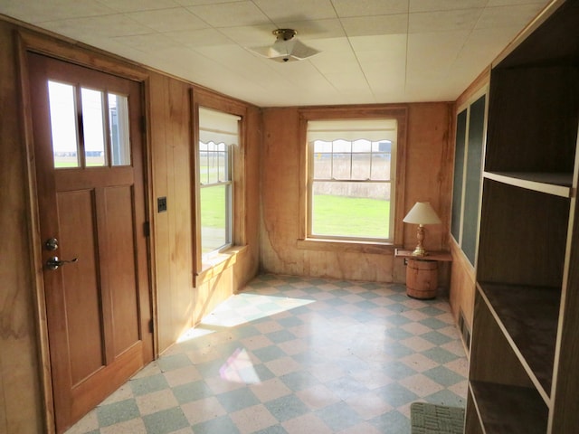 unfurnished sunroom with visible vents