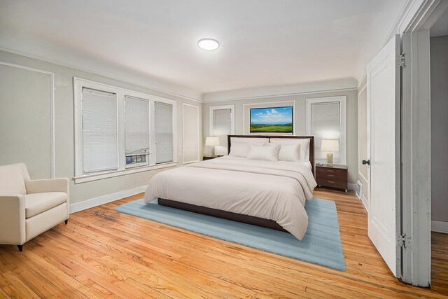 13605 Griggs St, Detroit, MI 48238 - bedroom featuring light wood-type flooring and baseboards