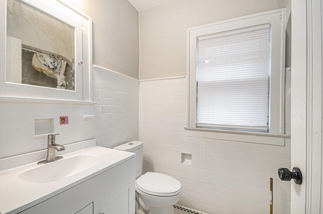 13605 Griggs St, Detroit, MI 48238 - bathroom featuring toilet, tile walls, and vanity