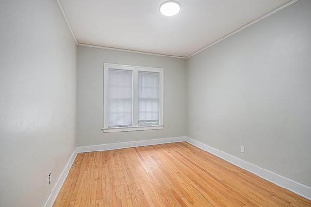 13605 Griggs St, Detroit, MI 48238 - unfurnished room featuring crown molding, baseboards, and light wood-style floors