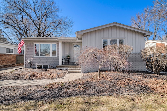 single story home with brick siding and fence